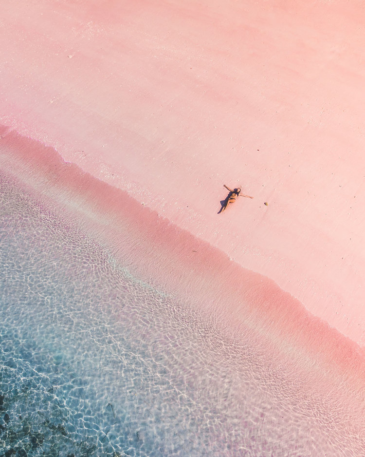 Laying in the sand of Pink Beach